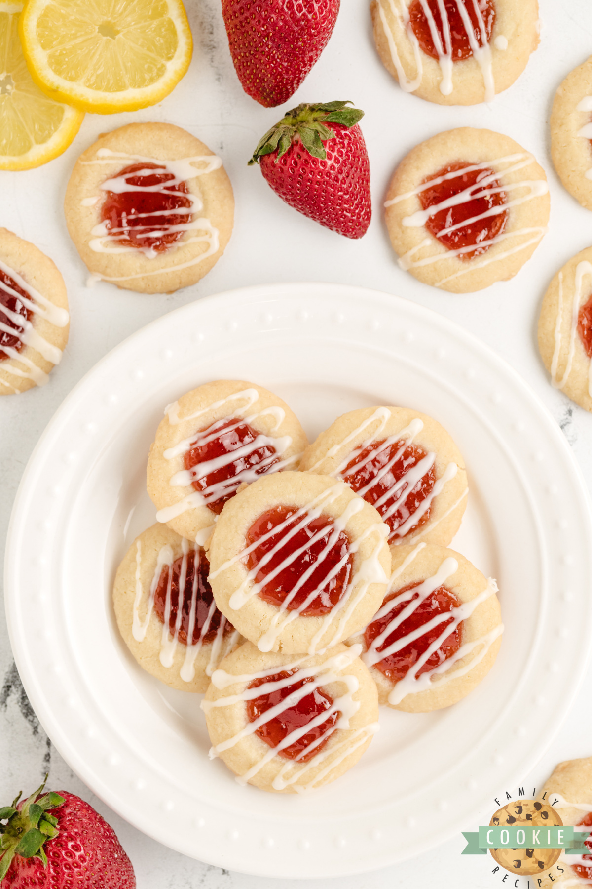 Lemon thumbprint cookies with strawberry filling and lemon glaze.