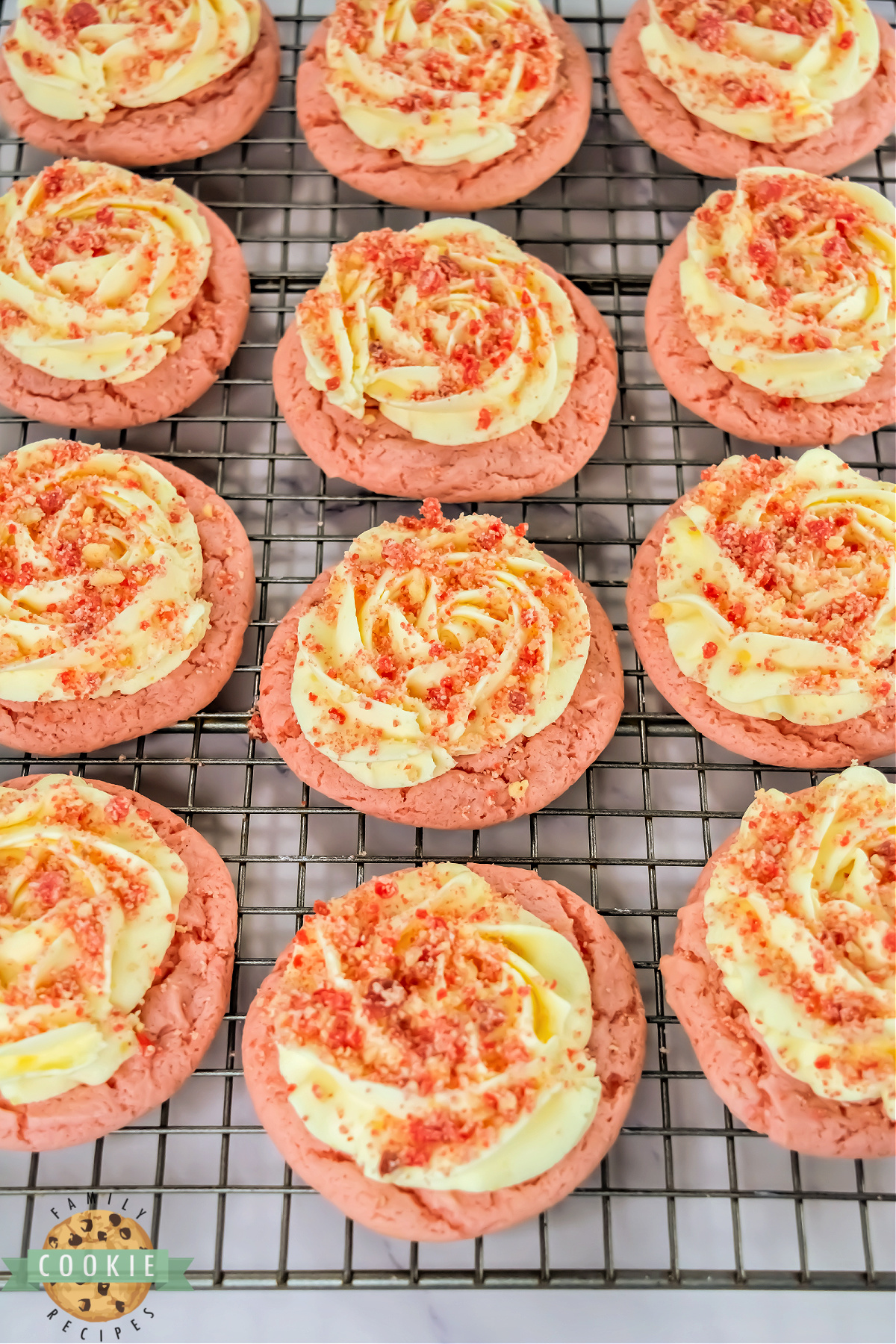 Copycat Crumbl Strawberry Shortcake Cookies on a wire rack.