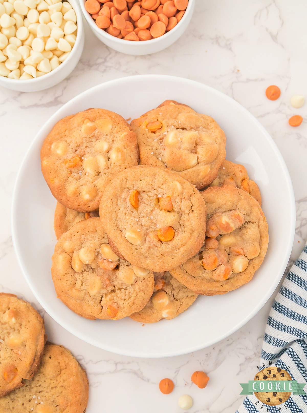 Plate of cookies with white chocolate chips and caramel chips. 