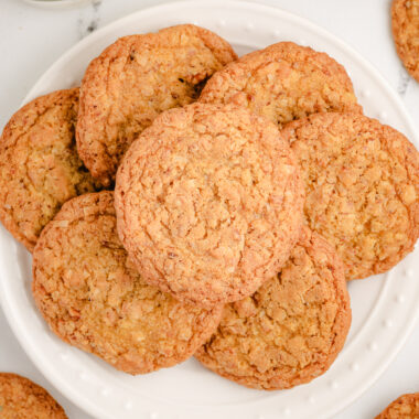 white plate filled with toasted coconut cookies