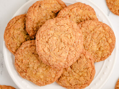 white plate filled with toasted coconut cookies
