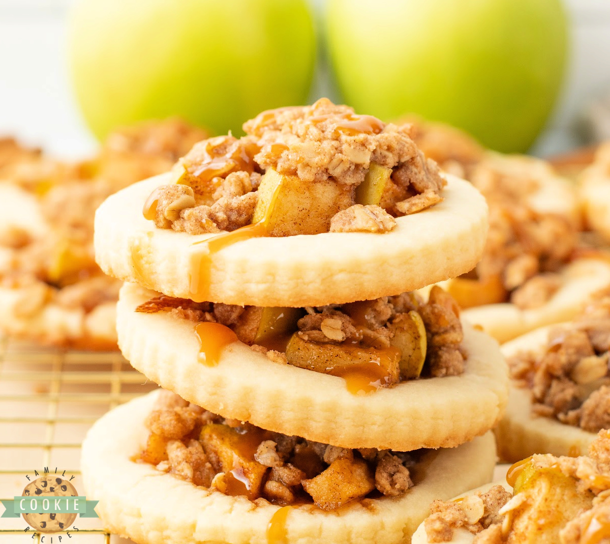Apple Crumble Cookies are filled with cinnamon-spiced apples, topped with a buttery oat crumble, and drizzled with caramel.