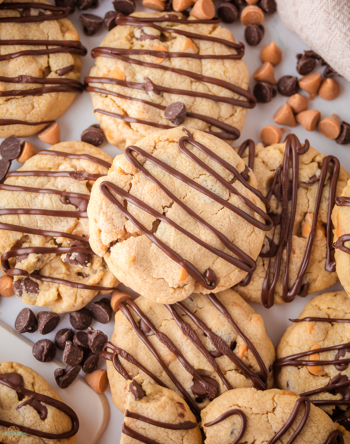 Scotcheroo cookies drizzled with melted chocolate