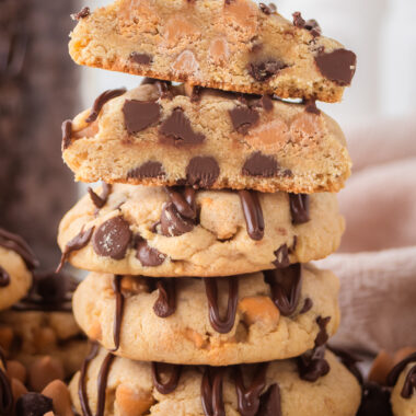 stack of Scotcheroo Cookies drizzled with chocolate