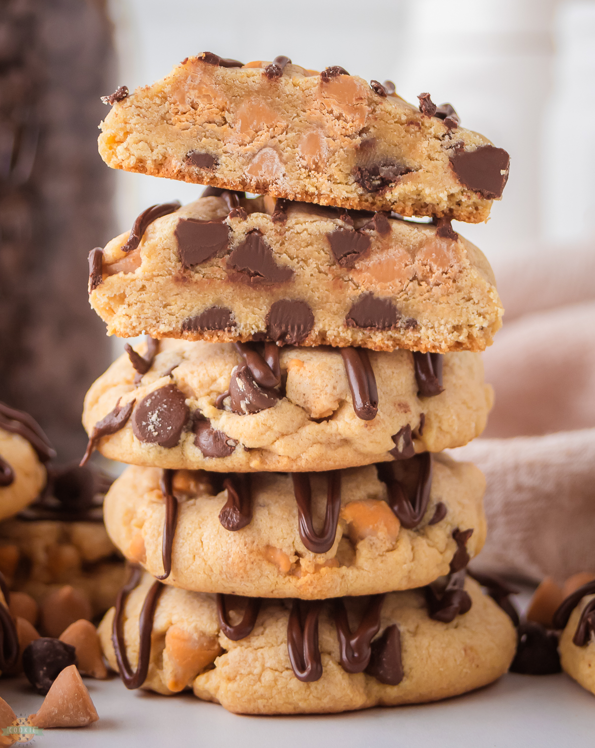 stack of Scotcheroo Cookies drizzled with chocolate