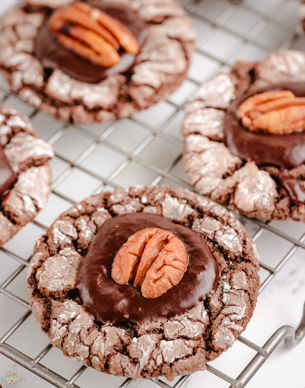 chocolate pecan crinkle cookies on a cooling rack