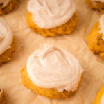 tray of frosted pumpkin cookies
