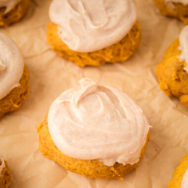 tray of frosted pumpkin cookies