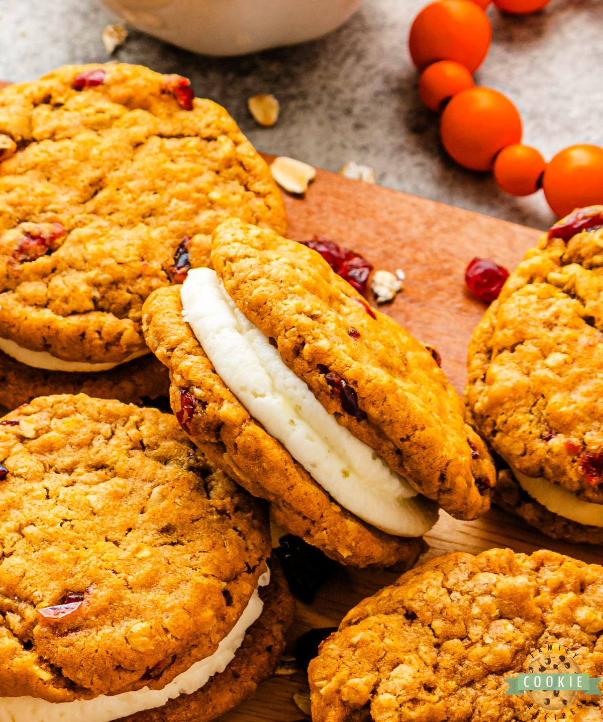 Chewy pumpkin oatmeal cookies with tart cranberries and cream cheese filling.