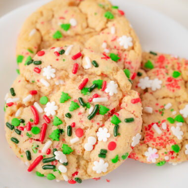 Christmas Sprinkle cookies on a white plate