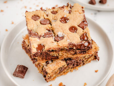 two Nestle Toll House Cookie Bars stacked on a plate