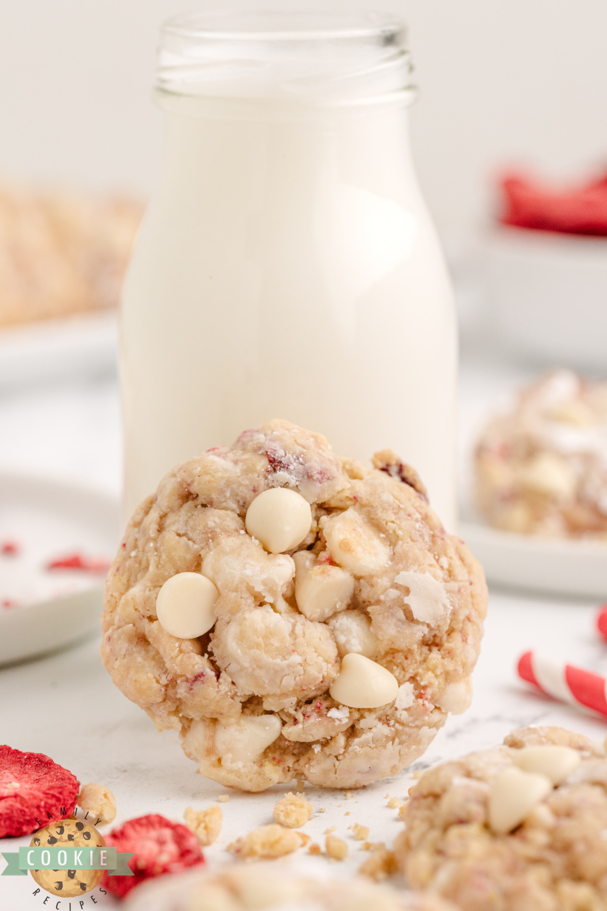 Strawberries and Cream Cake Mix Cookie next to a glass of milk.