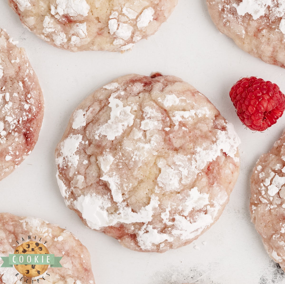Lemon raspberry crinkle cookies dusted with powdered sugar.
