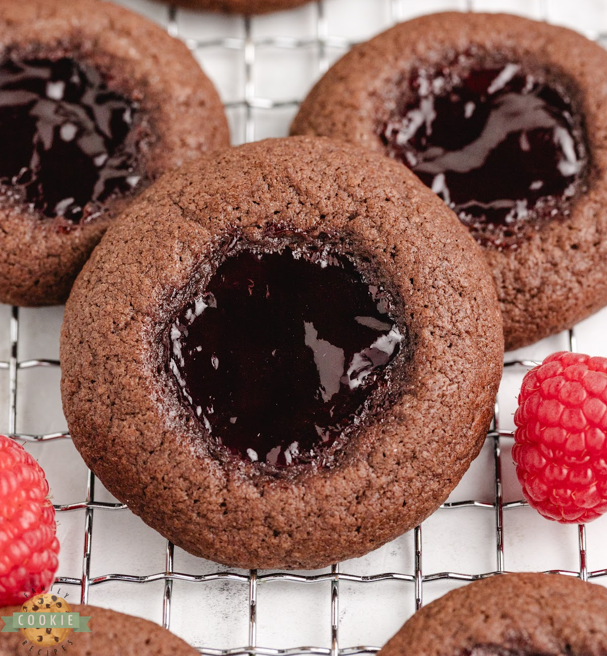 Raspberry chocolate thumbprint cookies filled with raspberry jam.