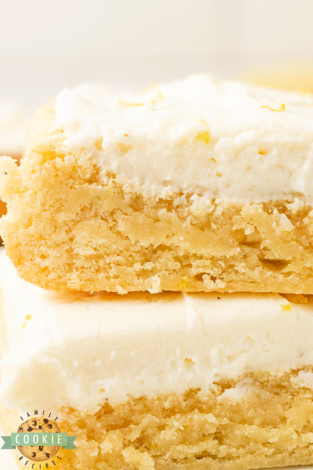 Soft and chewy lemon cookie bars with cream cheese frosting.