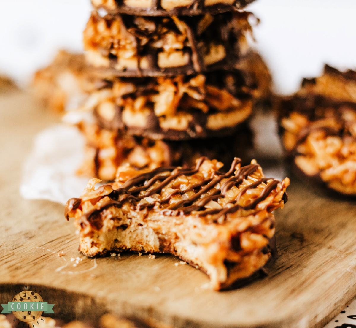 No-bake Samoas cookies made with fudge-striped cookies, caramel coconut topping, and chocolate drizzle.