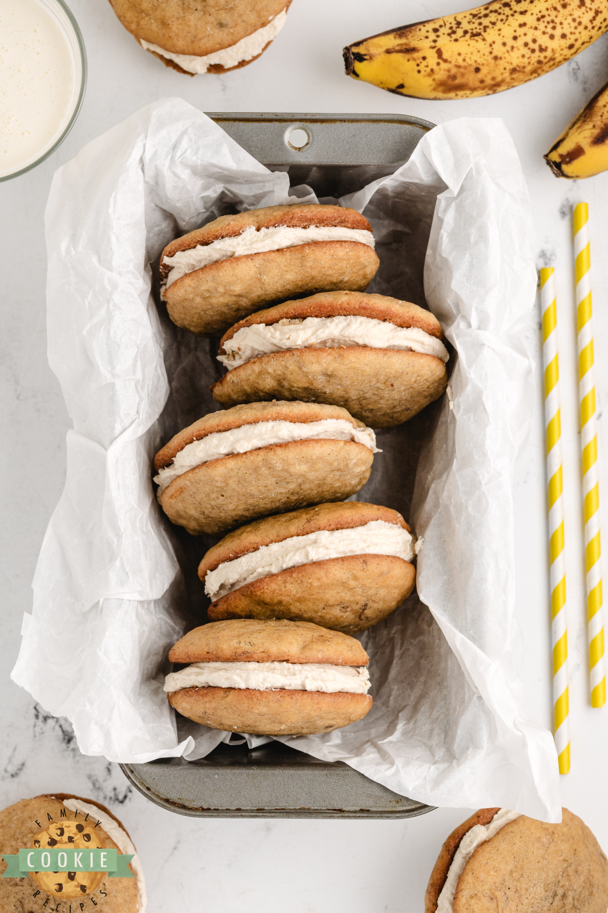 Homemade banana bread sandwich cookies with a thick layer of brown sugar buttercream frosting.