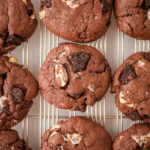 chocolate cookies and cream cookies on a baking sheet