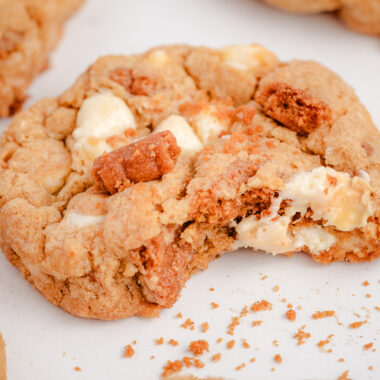 Biscoff cookie with white chocolate with a bite taken out of it