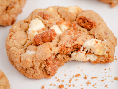 Biscoff cookie with white chocolate with a bite taken out of it