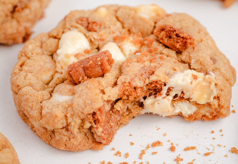 Biscoff cookie with white chocolate with a bite taken out of it