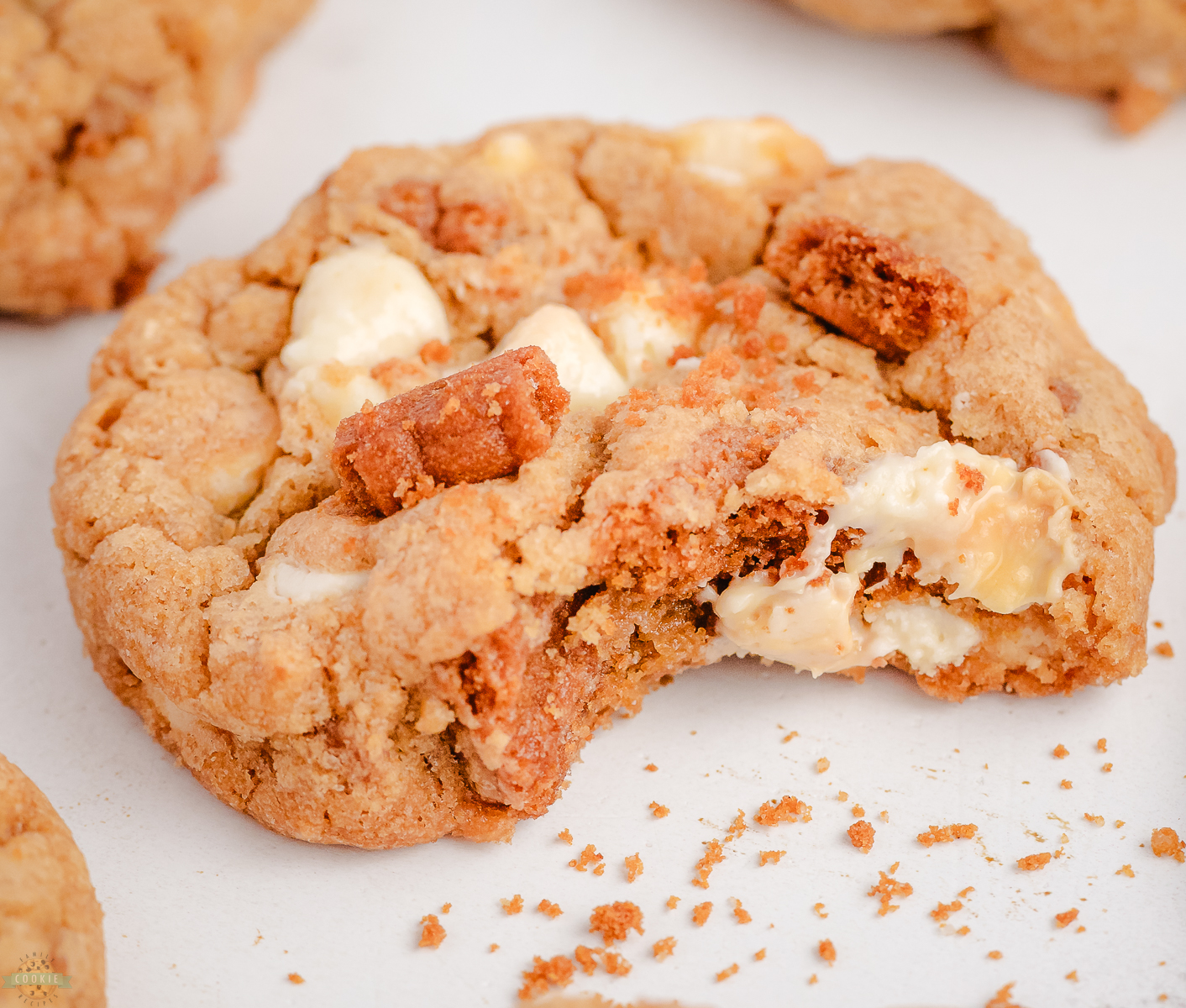 Biscoff cookie with white chocolate with a bite taken out of it