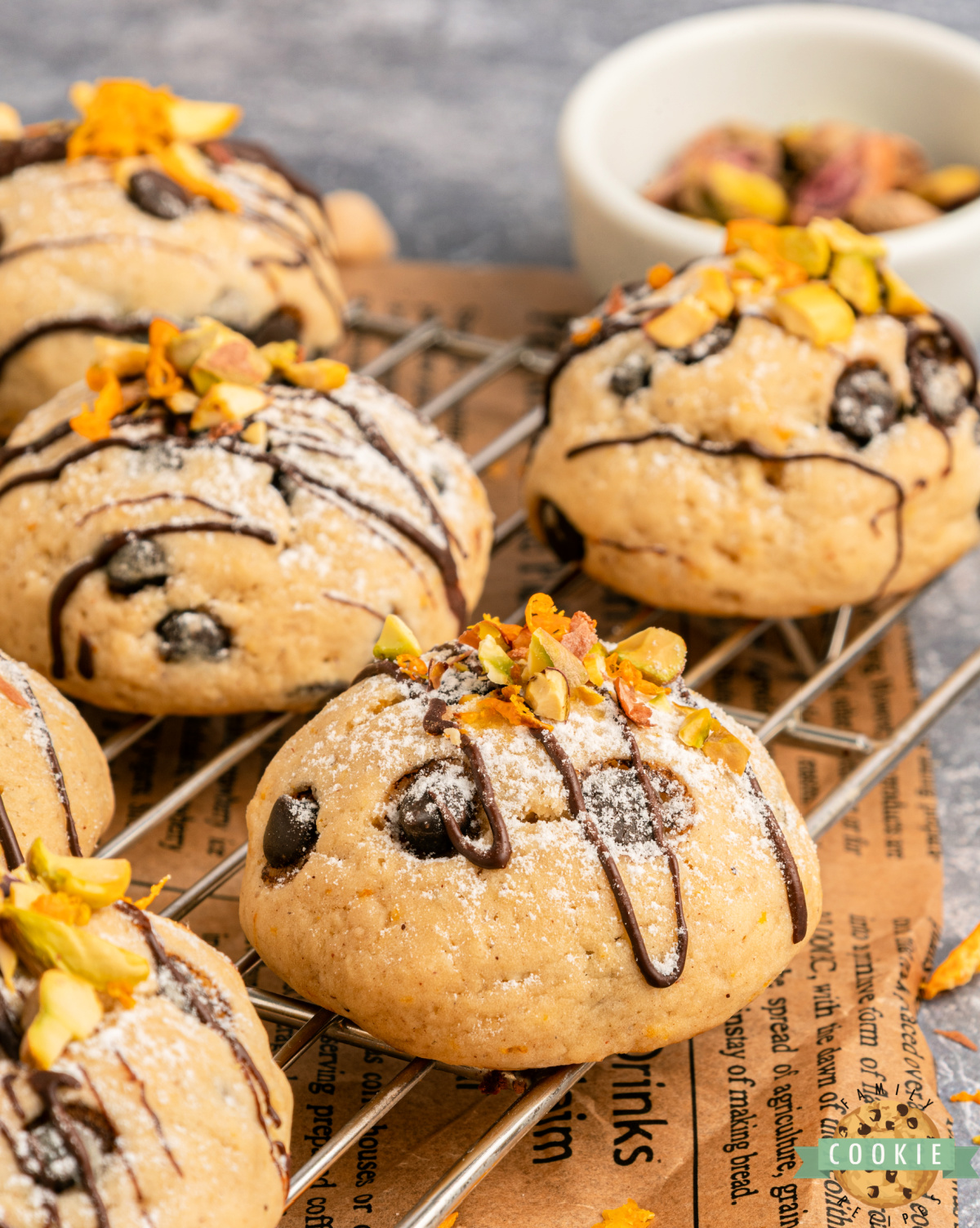 Freshly baked soft cannoli cookies on a baking sheet.