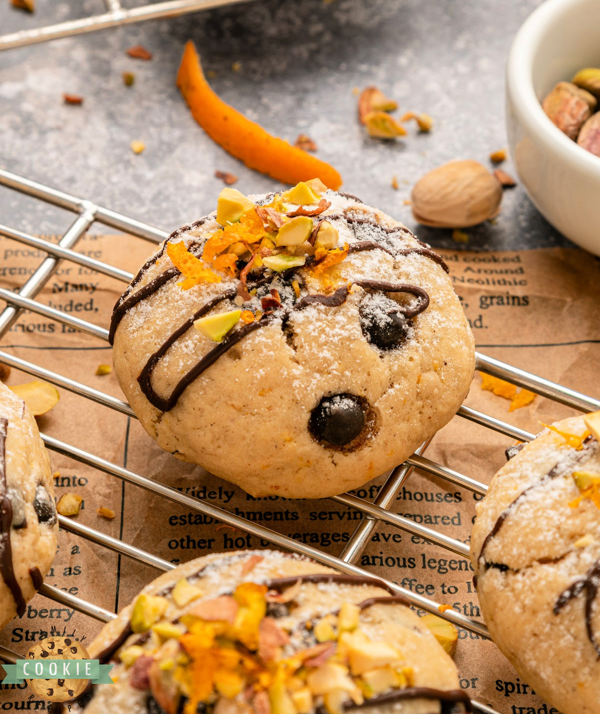 Close up of a soft ricotta cannoli cookie with mini chocolate chips and orange zest on top.