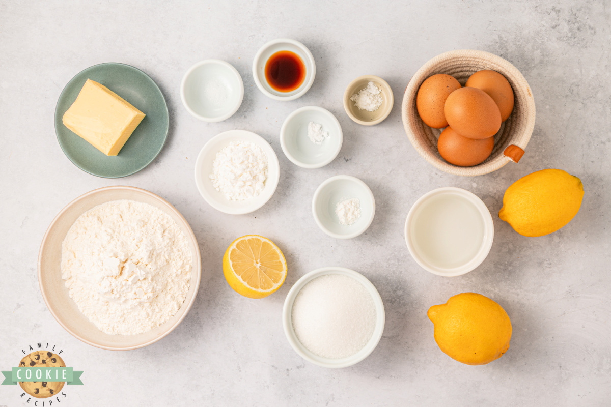 Ingredients for lemon meringue pie cookies including lemons, egg yolks, and sugar