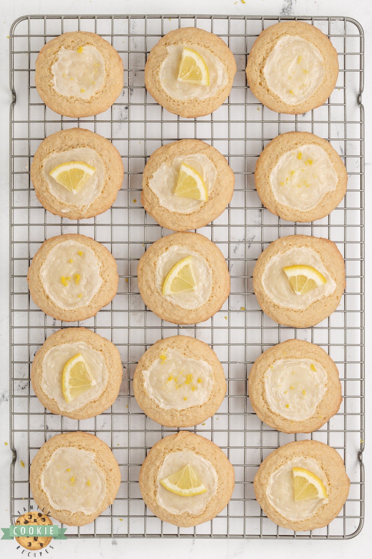 Lemon cheesecake cookies cooling on a wire rack 